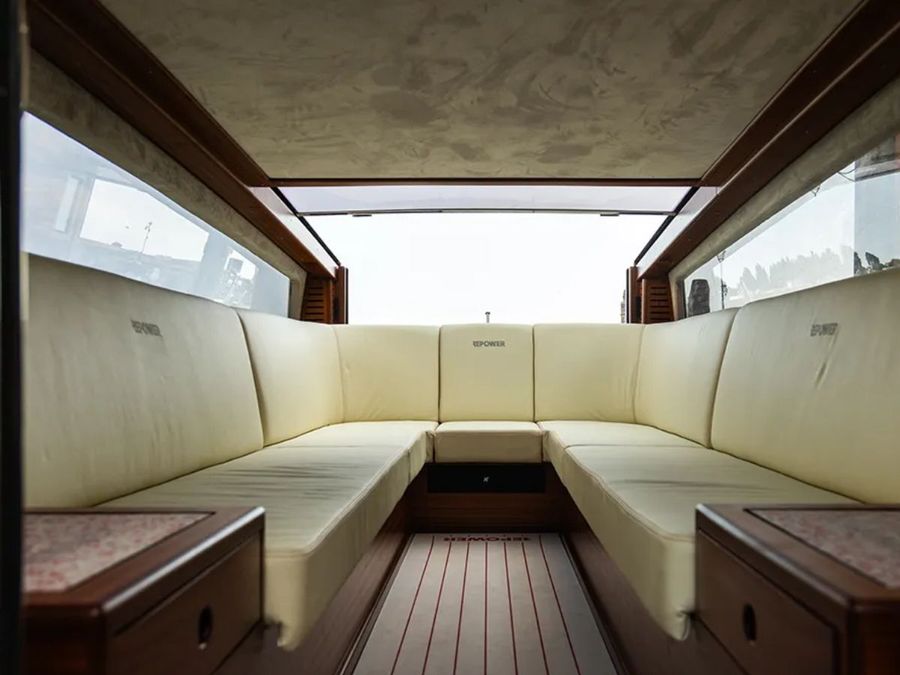 The-beige-upholstery-complements-the-rich-wood.-Lucietta-fits-14-people.-__-Photo-credit_-Repower.jpg