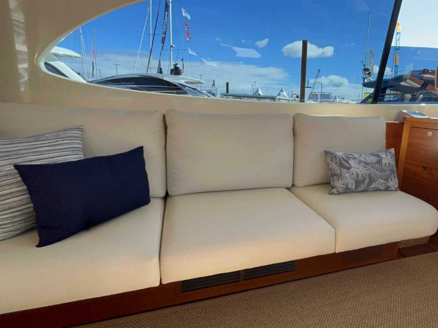 The central seating area, flanked by leather-upholstered sofas, creates a welcoming environment to unwind
