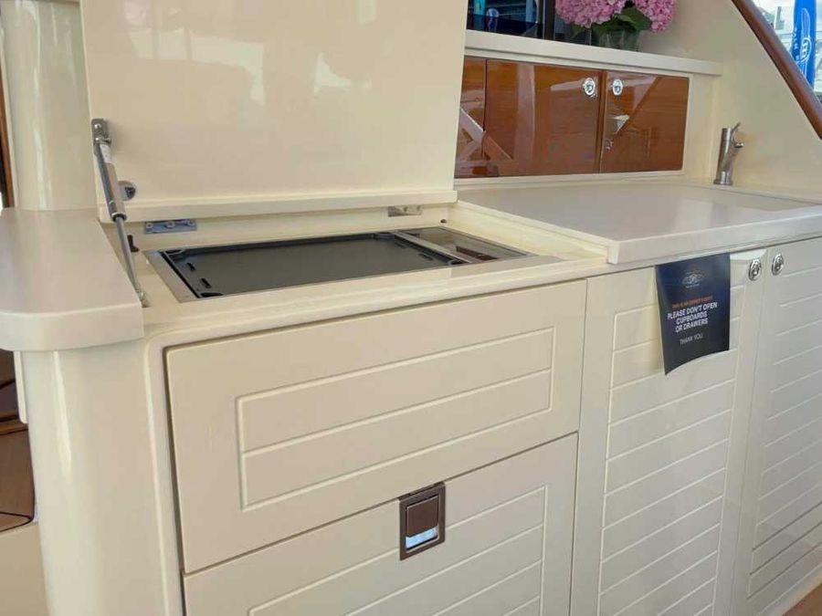 The deck galley includes a full sink and a gas cooktop, catering to everything from casual breakfasts to gourmet meals