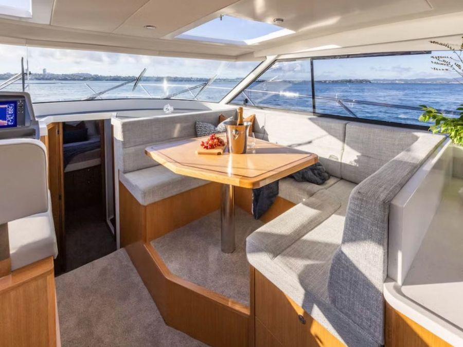 The dining area is perfectly positioned near the galley, elevated to capture natural light and offer stunning views of your surroundings