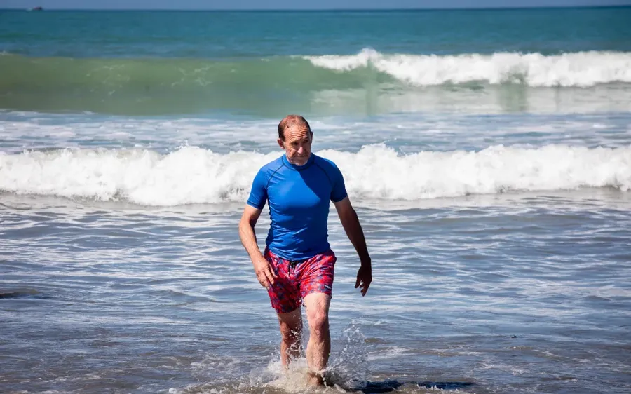 The-mayor-comes-out-after-a-dip-after-the-announcement.-Photo-credit-RNZ-Mark-Papalii.webp