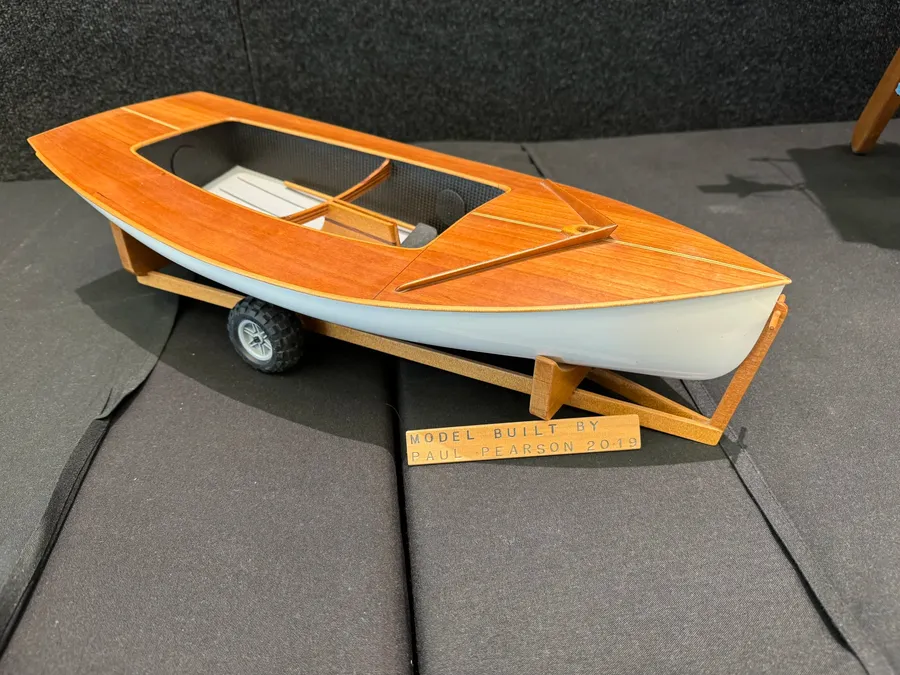 To-scale-model-of-a-Zephyr-dinghy-on-display-at-the-2025-Auckland-Wooden-Boat-show-Festival.webp