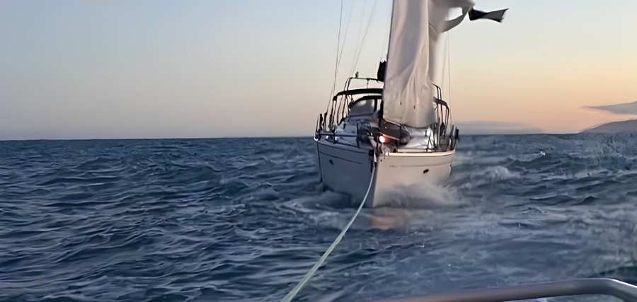 Two Coastguard Gisborne volunteers stayed aboard the injured skipper’s yacht throughout the long passage from Māhia to Gisborne.