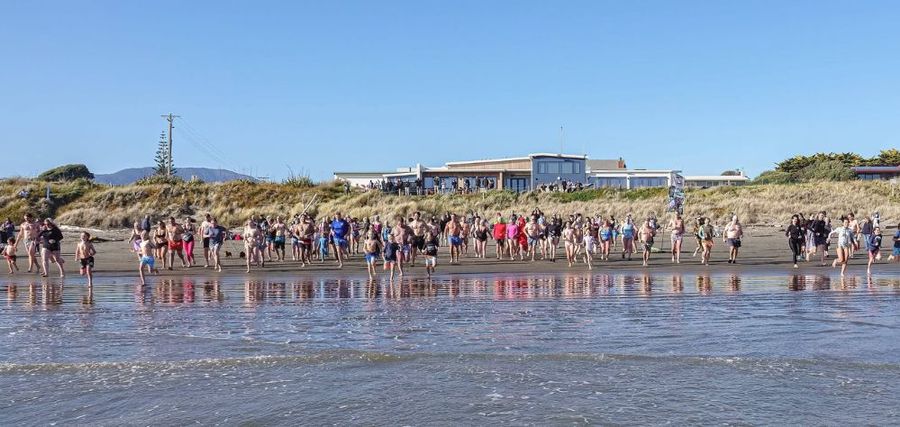 Waikanae Boating Club with Winter Swim in the foreground