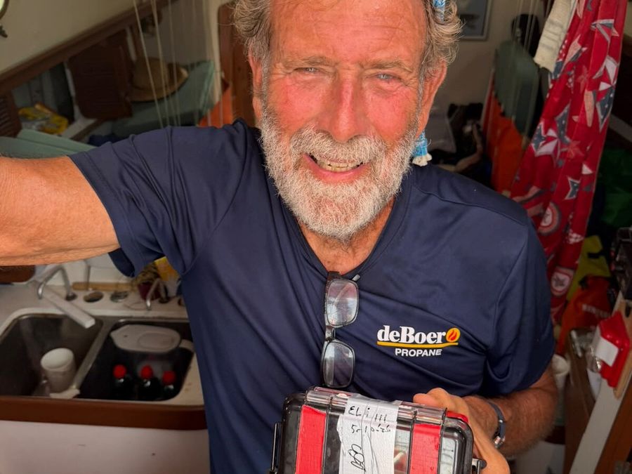 Guy deBoer ticks off final requirements before returning to sea aboard Spirit, including sealing his smartphone under GGR rules, as his Chichester Class adventure continues after repairs and inspections in Lanzarote. Credit: Eli Van den Broek