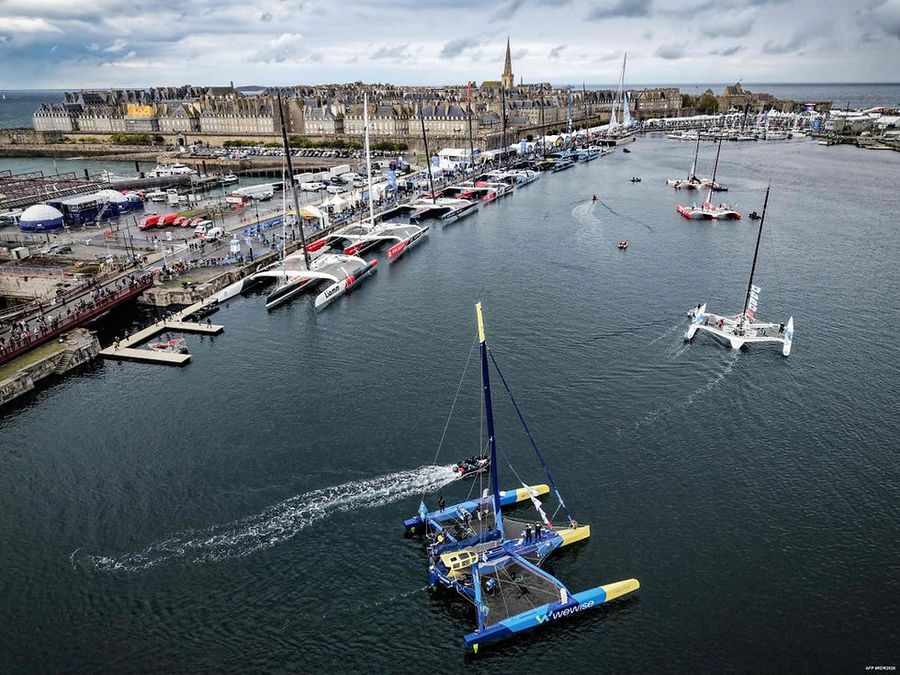 The first Ocean Fifty boats finish in the basin at Saint-Malo (Photo: Lou Benoist / AFP)