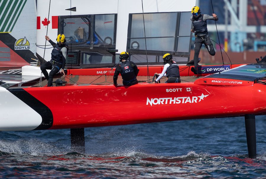 Canada NorthStar SailGP Team in action with Annie Haegar, strategist of Canada NorthStar SailGP Team, driving as Giles Scott, driver of Canada NorthStar SailGP Team, crosses the boat with Tom Ramshaw, grinder of Canada NorthStar SailGP Team, on Race Day 1 of the Rolex Los Angeles Sail Grand Prix held in the Port of Los Angeles, California, USA. Saturday 15 March 2025. Rolex SailGP Championship Event 4 Season 2025. Photo credit: Felix Diemer / SailGP media