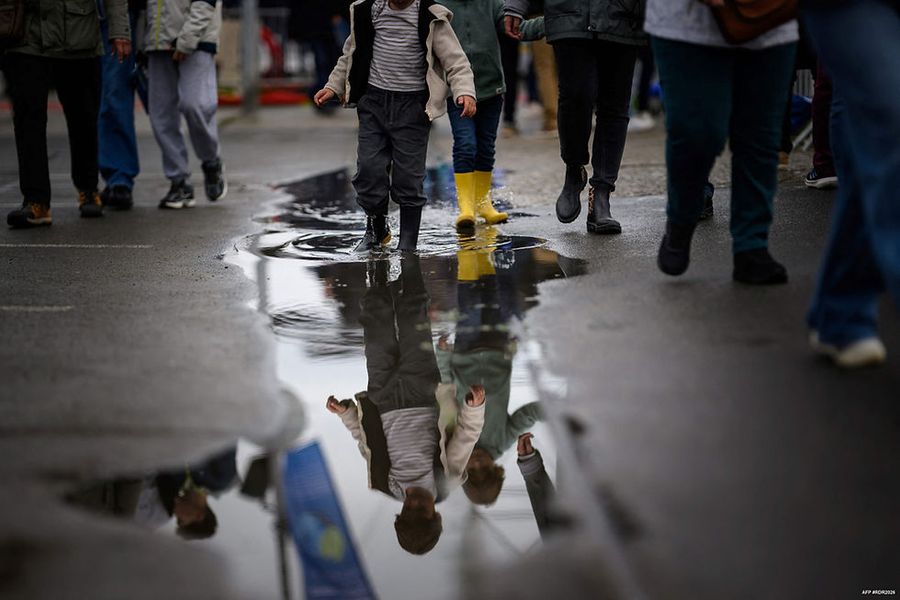 Mirrored smiles shared among the crew ahead of the race (Loïc Venance/AFP)