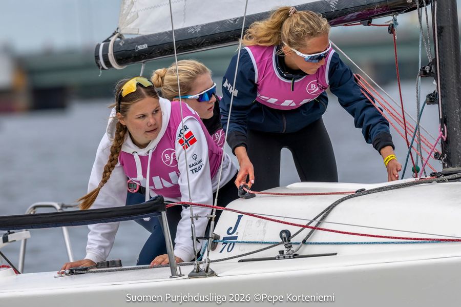 A women's crew races hard in the J/70 semi-final competition off Helsinki