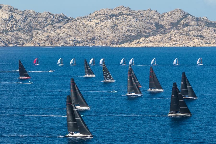 ClubSwan 50 and ClubSwan 28 fleets race past the island of Caprera during the 2026 Rolex Swan Cup. Photo: Rolex/Studio Borlenghi