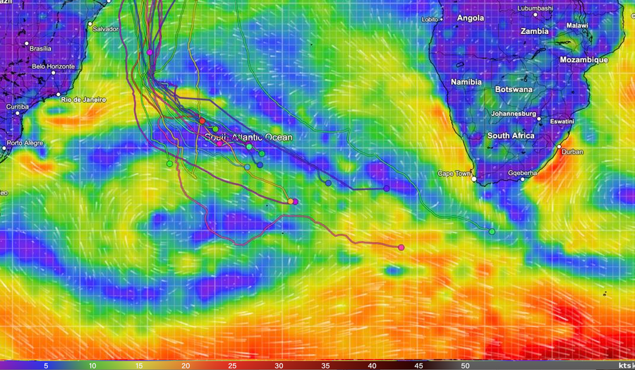 Wind map of the South Atlantic with the Golden Globe Race tracks, showing the leader's pink track reaching orange stronger wind to the south-east and most of the fleet in blue and purple light air to the north-west.