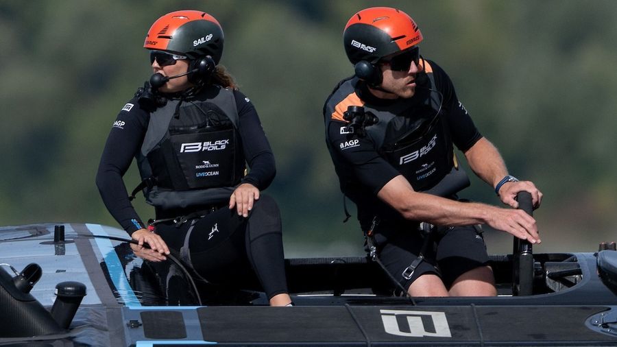 Pete Burling and Liv Mackay on board the Black Foils during racing in Geneva