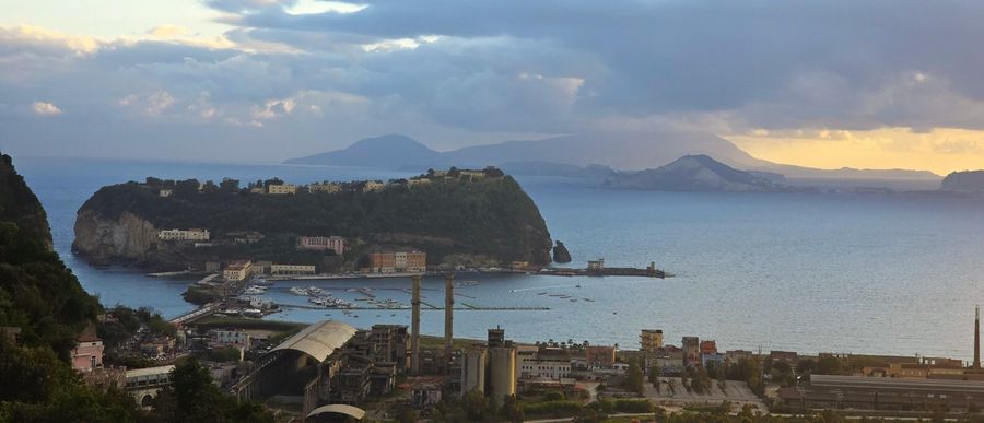 Nisida, a small volcanic crescent-shaped islet, sits within the Gulf of Naples.