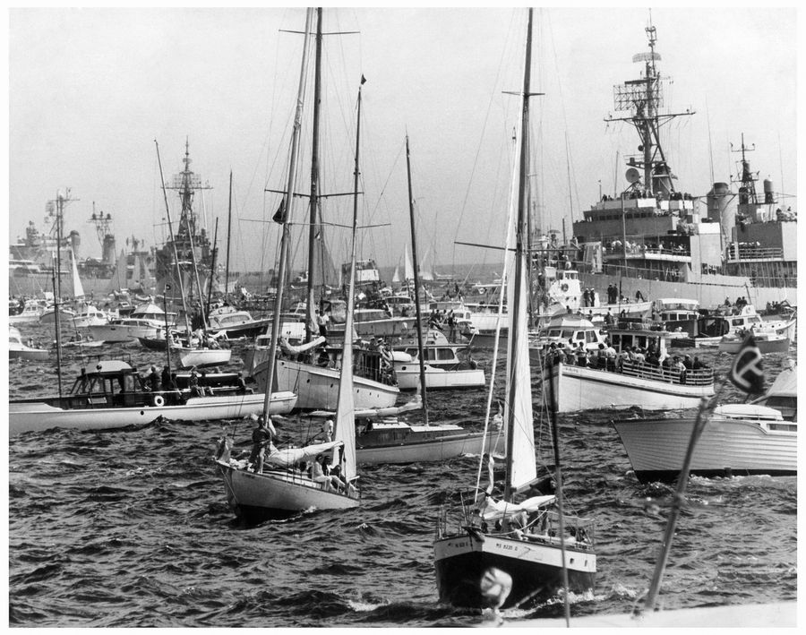 Circa 1962: the America's Cup spectator fleet gathers, drawn to the 12-metre boats challenging just as crowds had for larger yachts in earlier decades.