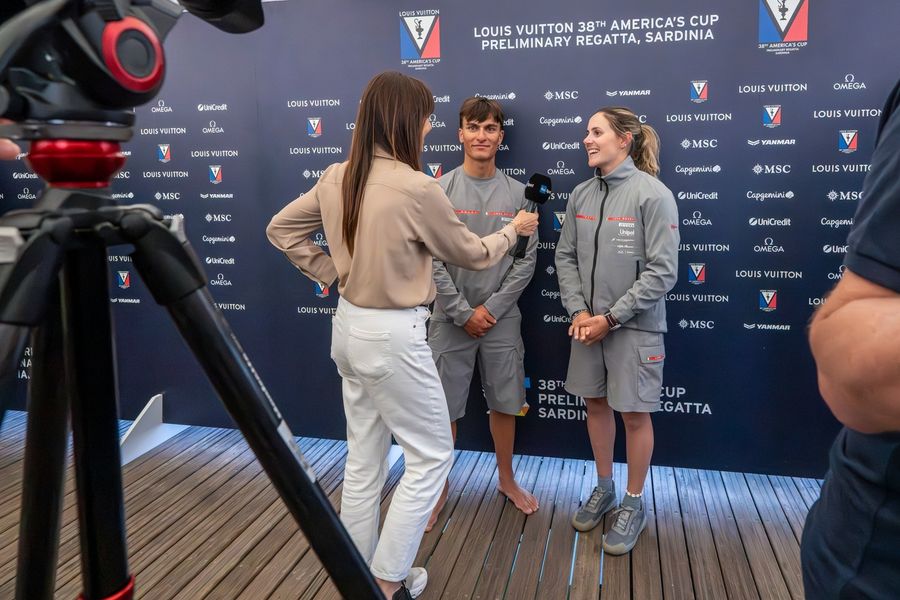 Marco Gradoni and Margherita Porro front the mixed zone for Luna Rossa Team 1 at the Sardinia preliminary regatta, 24 May 2026.