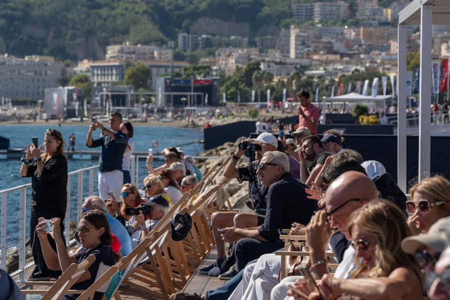 The race village draws a lively crowd during the Louis Vuitton 38th America's Cup Preliminary Regatta in Naples, 26 September 2026. Photo: Francesca Ardau/America's Cup