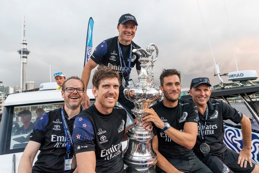 Dan Bernasconi, Peter Burling, Glenn Ashby, Ray Davies and Blair Tuke with the America's Cup Trophy at the 36th America's Cup prize giving in Auckland.