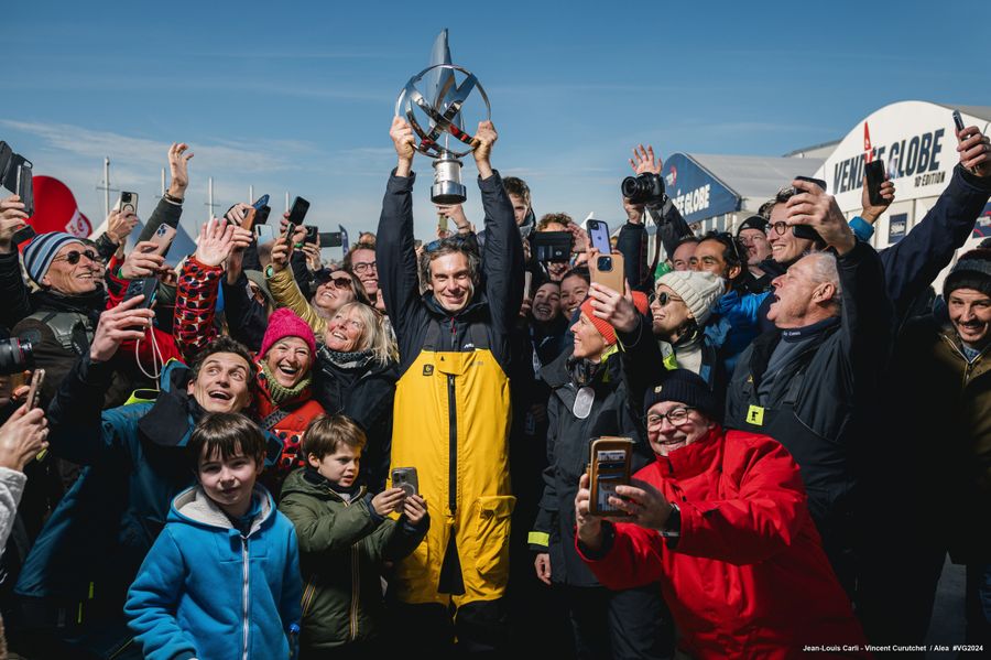 MACIF Santé Prévoyance skipper Charlie Dalin (FRA) is posing with the crowd on pontoons, in a specific series of portraits shot after winning the Vendee Globe, on January 14, 2025 in Les Sables d'Olonne, France - Photo credit: Vincent Curutchet - Jean-Louis Carli / Alea